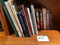Books on shelf including titles British Columbia - Our Land, The Best of LIFE, A Heritage of Canadian Art, Chaki among others.