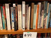 Books arranged on a shelf, showing titles and authors focused on literature and history.