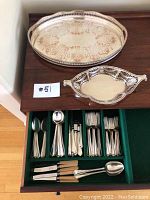 Photo showing both trays on top of cabinet with organized cutlery drawer below, illustrating the entire lot contents together.