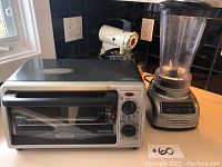 Photo showing Black & Decker silver toaster oven and KitchenAid blender on countertop with vintage mixer in background