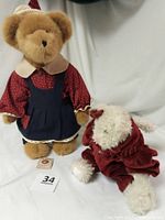 Photo showing the two Boyds Bears together on a white backdrop, golden-brown Bailey Ann bear with patriotic clothing and white Bearwear bear in red velvet jumper.
