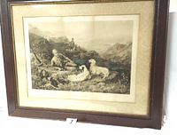 Front view of the framed print showing man with hunting dogs in mountainous terrain.