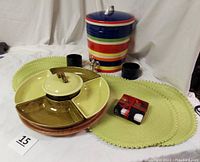 Full lot view showing beverage dispenser, vegetable server on Lazy Susan, placemats, and fused glass coasters