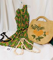 Full lot composition with cover-up on hanger, two Cowrie shell leis, Kukui nut lei, and jute tote bag displayed together.