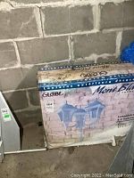 Photo of original box with image and product details showing Mont Blanc Globe 3-light outdoor lantern, model 04275.