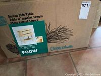 Photograph of the unopened cardboard box containing the Chaparral Furniture Seneca Side Table model 900W, showing the product image and branding.