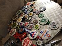 Photo showing the full collection spread on table, various sizes and team logos visible.