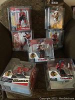 Full view of seven McFarlane hockey figures in Chicago Blackhawks themed packaging with player names visible.