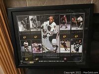 Front view of a black-framed collage photo showing multiple images of Bobby Hull in different hockey jerseys with accompanying text and logos.