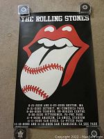 Photo of Rolling Stones 2005 USA and Toronto baseball stadium tour poster showing the iconic tongue and lips logo with baseball stitching on tongue and tour dates listed below.