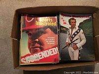 Box showing neatly stacked Sports Illustrated magazines with Pete Rose on front cover of top issue