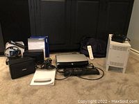 Full layout of all components on carpet in front of cabinet