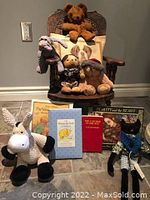 Photo of the rocking chair with teddy bears and children's books arranged around it.