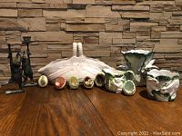 Photo of whole lot showing egg basket, eggs, two planters and two bunny candle holders.