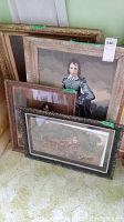 All four framed artworks grouped together showing various subjects and decorative frames.