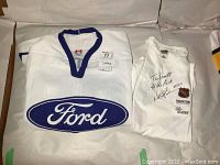 White Ford jersey and white NHL T-shirt displayed together