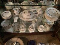 Full lot of Meakin Rose Marie pattern china including dinner plates, salad plates, bowls, vegetable server, platter, cream and sugar set, cups and saucers.