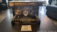 Front view of unopened Funko Pop Heroes Batman and Commissioner Gordon Movie Moments set in original packaging. Box displays both figures flanking the Bat-Signal.