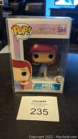 Front view of Funko Pop Disney The Little Mermaid Ariel #564 in unopened box with Pop Protector.