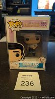 Front view of Funko Pop box showcasing Prince Eric figure and numbered 565 with visible packaging and Pop Protector.
