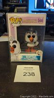 Front view of unopened boxed Funko Pop figure of Scuttle from The Little Mermaid, showing number 566 and character image