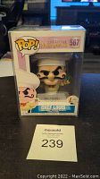 Front view of unopened Funko Pop box containing Chef Louis figure, displaying the figure and branding clearly with MaxSold auction number 239 visible.