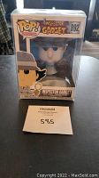 Front view of unopened Funko Pop Inspector Gadget figure in plastic protector with seller's lot number visible