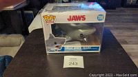 Front view of Funko Pop Movies Jaws Great White Shark figure in original box with pop protector.