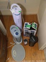Photo of various fans, diffuser, and scale from above showing overall items included