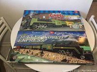 Two boxed President's Choice train sets stacked; Mini Chefs Express on top and Bullet-Nosed Express below.