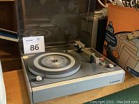 Telefunken turntable view from front showing platter, control knobs, and dust cover