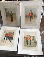 Four British military prints in white mattes laid flat showing distinct uniformed soldiers in vintage settings.