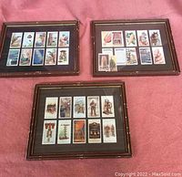 Three framed sets of vintage smoking trading cards displayed front side showing colorful illustrations on each card arranged in rows within frames.