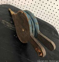 Side view of the bellows showing the blue-green leather sides and wooden structure