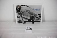 Full view of the 10x8 inch black and white glossy photograph featuring the Enola Gay and pilot Paul Tibbets.