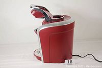 Side view of the red and silver Keurig 2.0 K400 coffee maker with power cord visible.