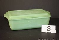 Side view of the rectangular green jadeite dish with lid, showing overall size and shape.