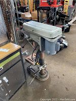 Full side view of Canem 878 drilling machine showing the drill head, controls, base, and column.