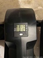 Close-up photo of Cubii seated elliptical trainer digital display showing distance, RPM, time, and calories.