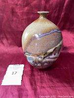 Front angle of hand crafted ceramic vase showing handcrafted glaze and shape