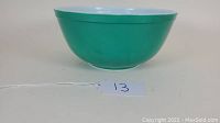 Side view of Pyrex 403 green mixing bowl showing exterior and bowl shape