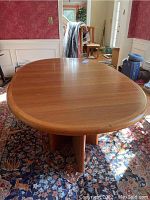 Top view of oval tabletop showing wood grain and finish