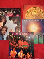 Five vintage vinyl album covers visible including Daryl Hall & John Oates, two Earth Wind & Fire, Three Dog Night, and Orleans albums