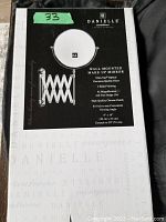 Front of boxed makeup mirror showing brand Danielle, 6X magnification label, and scissor arm extension feature.