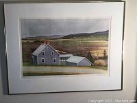 Framed serigraph depicting a gray house with surrounding farmland and hills in muted earth tones, with white mat and frame visible