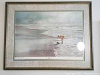 Front view of framed colograph art depicting a beach scene with a figure, show full artwork and frame