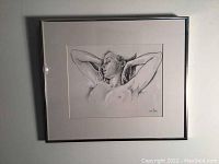 Full view of the framed print showing a reclining nude woman, matted and framed in aluminum.