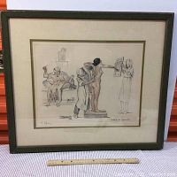 Full front view of framed etching with ruler at base