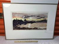 Full view of framed watercolor artwork showing the entire scene with trees, water, and sky, framed in silver aluminum with white matting.