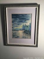 Framed original watercolour painting depicting lake, trees, mountains at sunset or dusk.